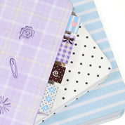 Set of three fabric sew in label bookmark tabs with 4 different patterns on a white background