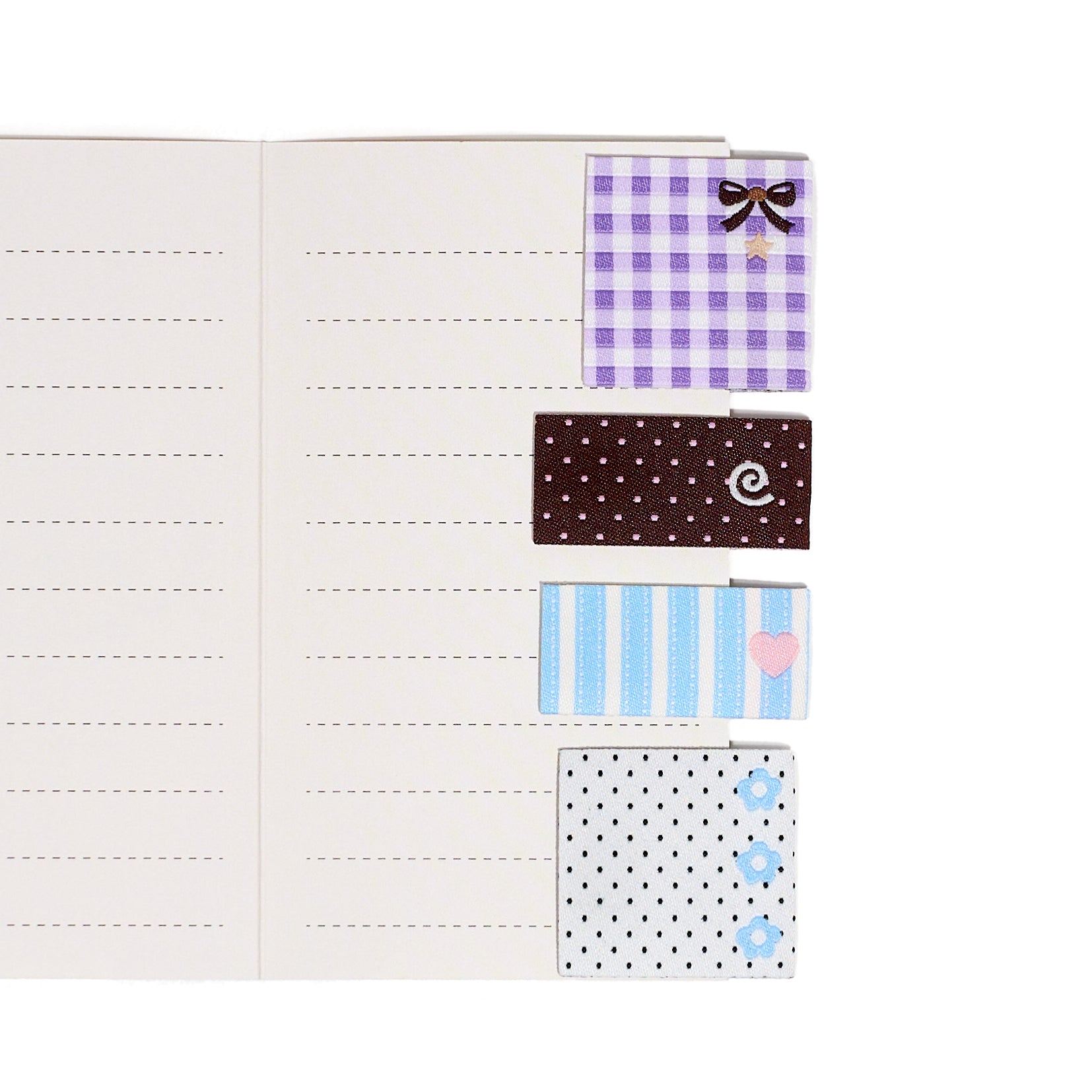 Set of three fabric sew in label bookmark tabs with 4 different patterns on a white background