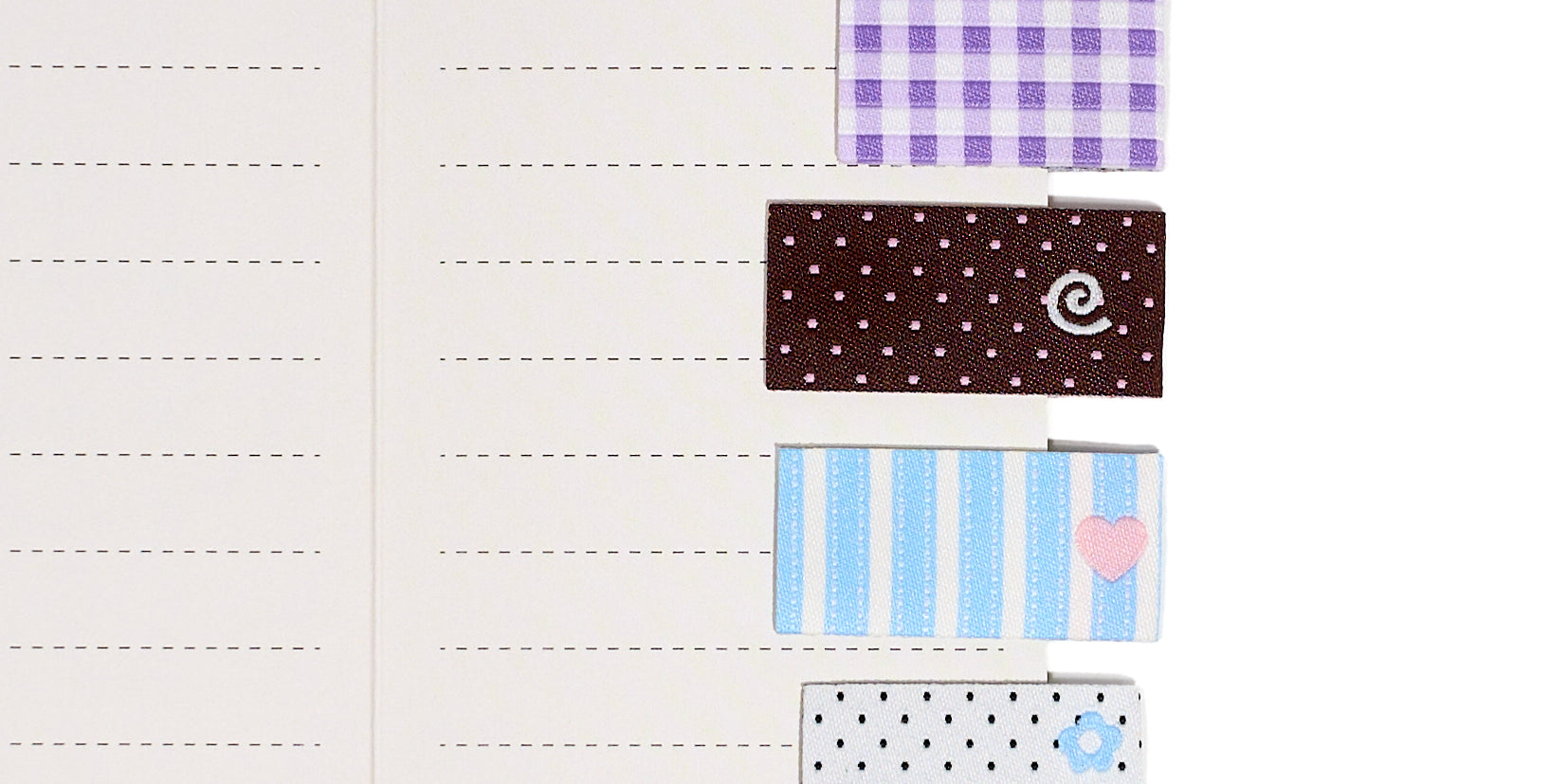 Set of three fabric sew in label bookmark tabs with 4 different patterns on a white background
