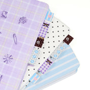 Set of three fabric sew in label bookmark tabs with 4 different patterns on a white background
