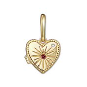 Gold heart-shaped locket with sunburst design and red gemstone on a white background