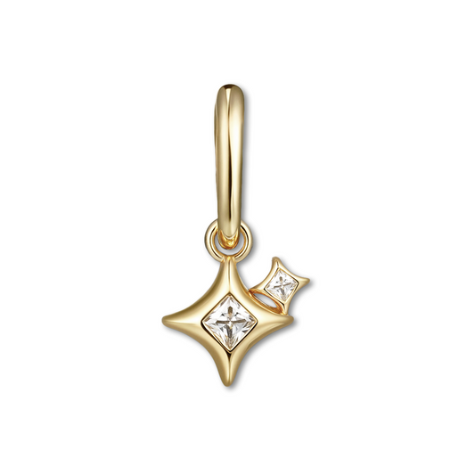 Gold pendant with star design and small diamond on a white background